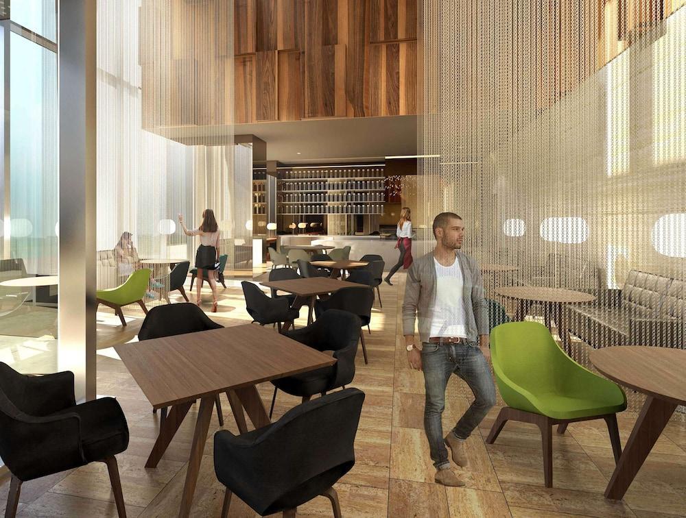 Aleph Doha Residences, Curio Collection By Hilton Exterior foto The interior of the new restaurant