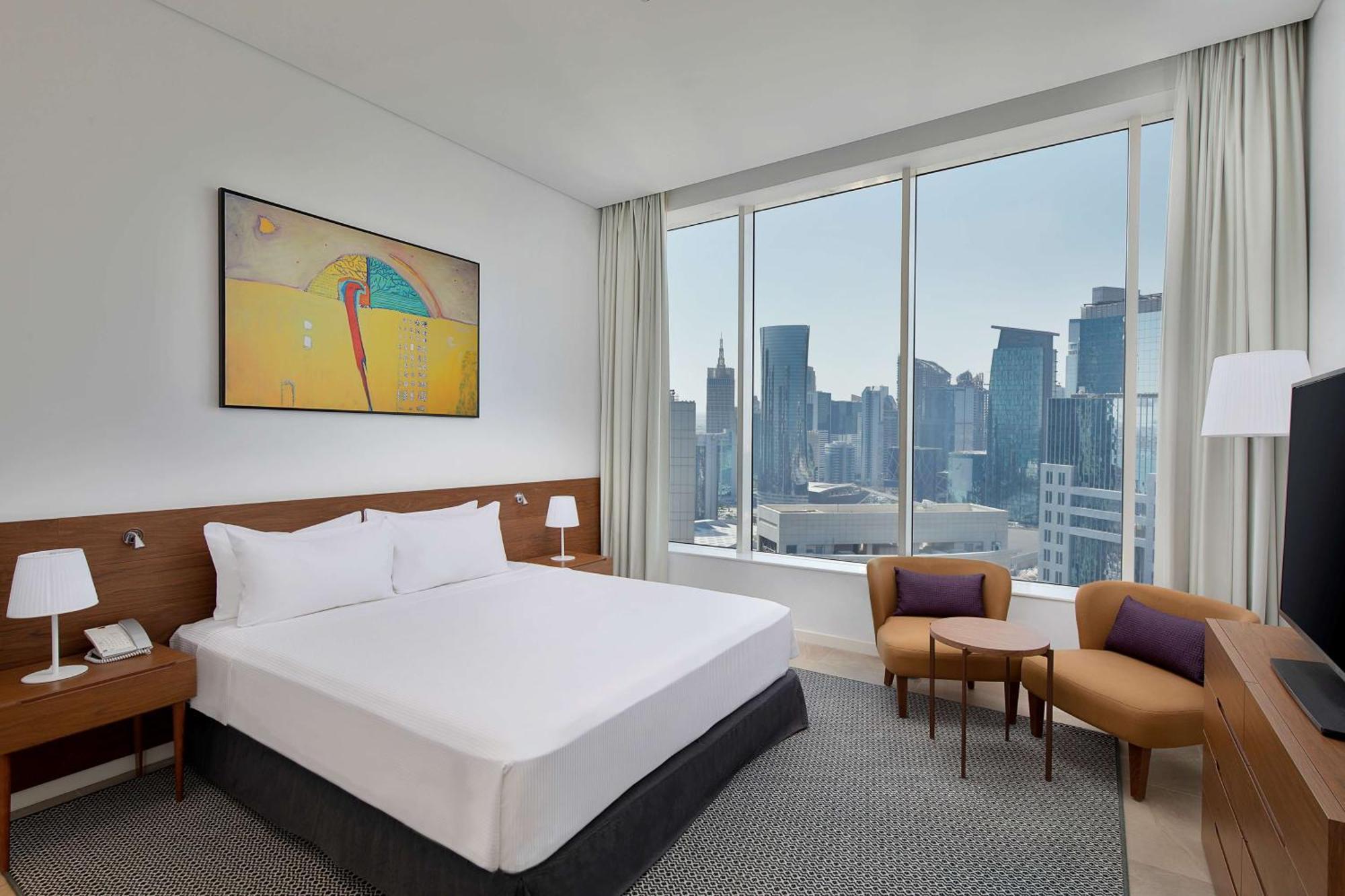 Aleph Doha Residences, Curio Collection By Hilton Exterior foto A bedroom at the hotel