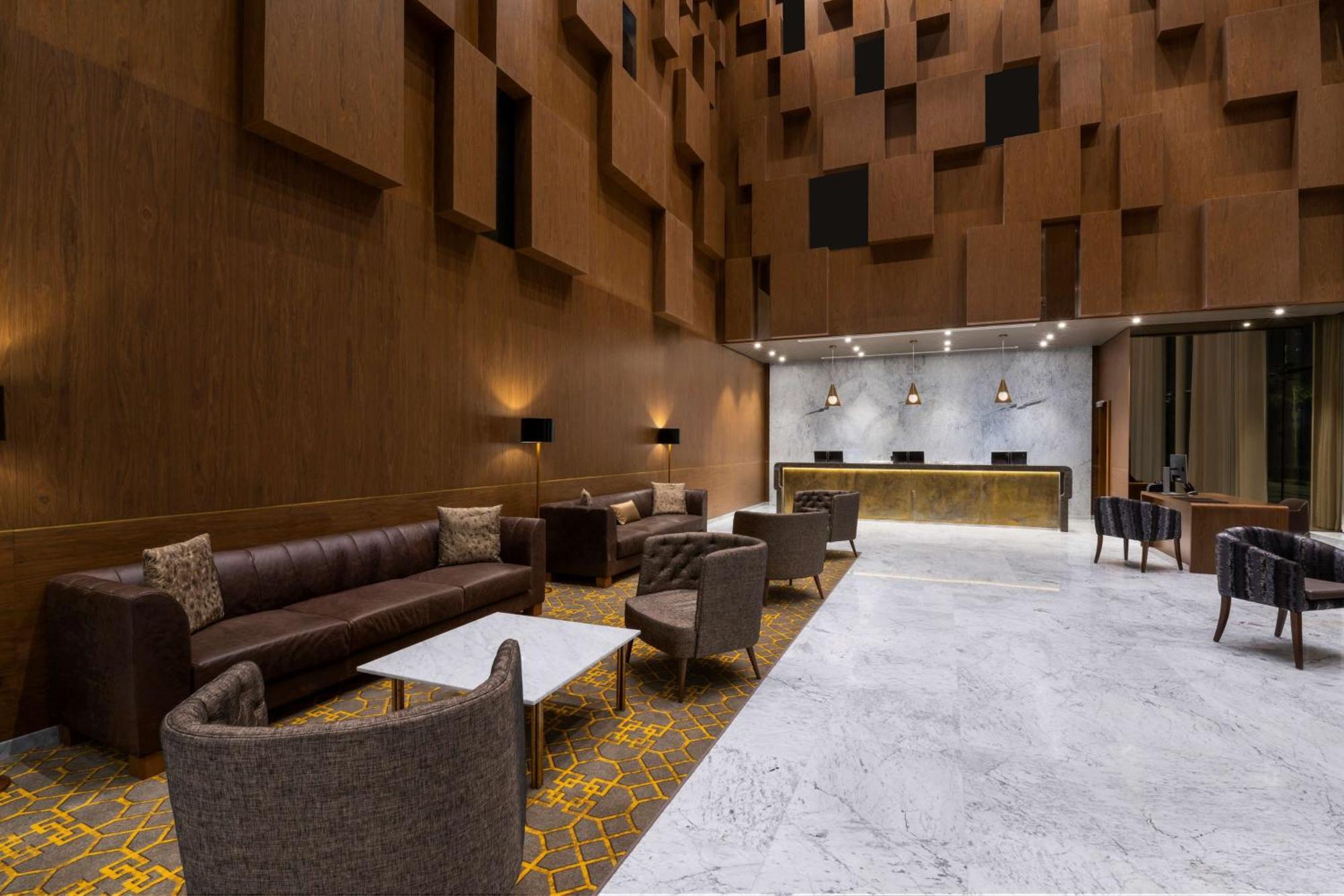 Aleph Doha Residences, Curio Collection By Hilton Exterior foto The lobby of the hotel