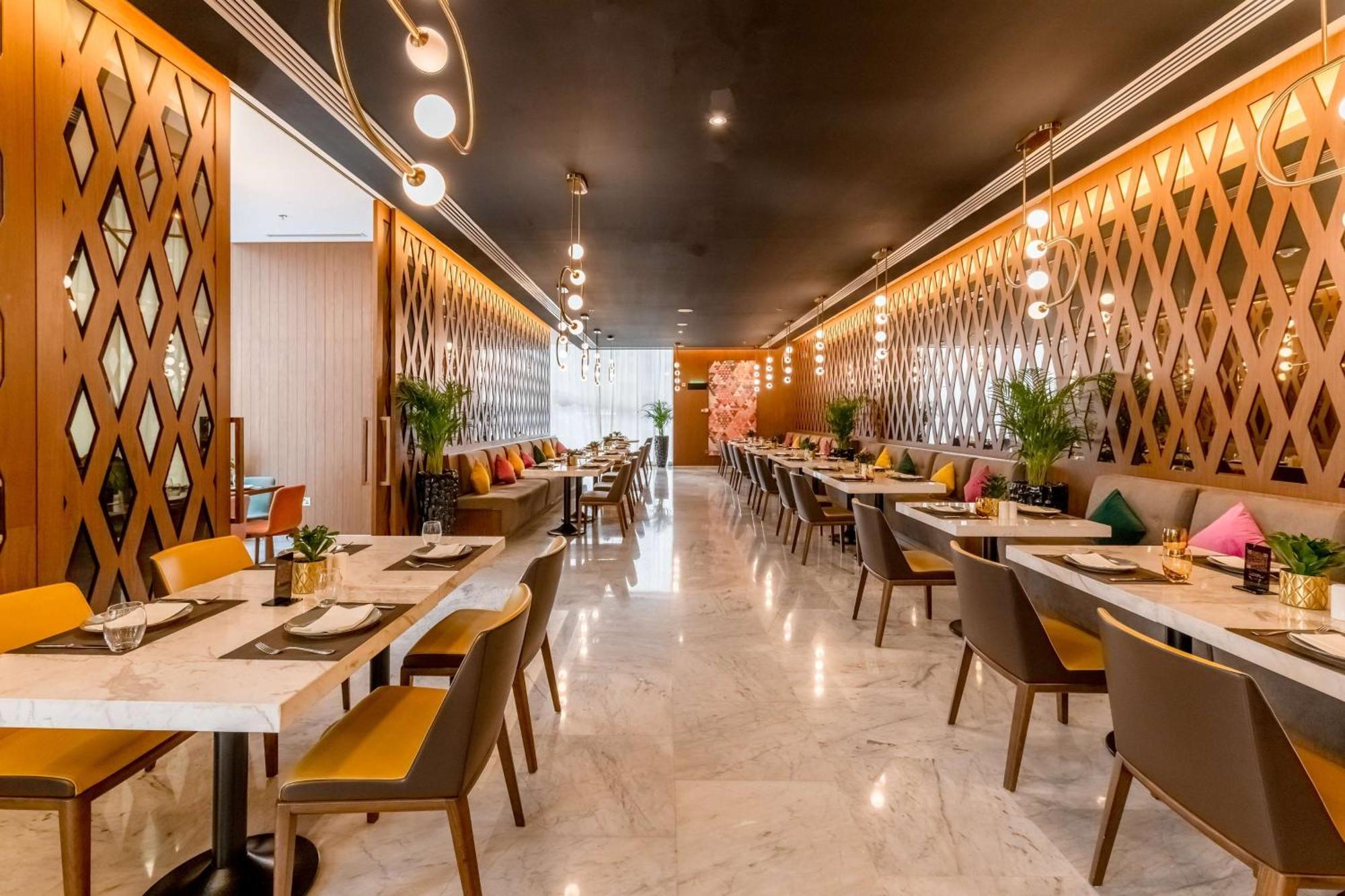 Aleph Doha Residences, Curio Collection By Hilton Exterior foto The interior of the restaurant